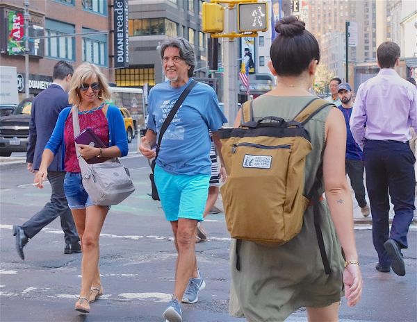 Tourists actually smile when you take their photo...