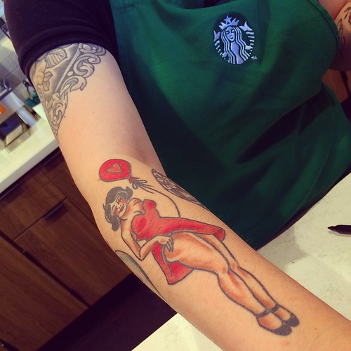 Betty Boop Arm Tattoo on Starbucks Employee's Arm