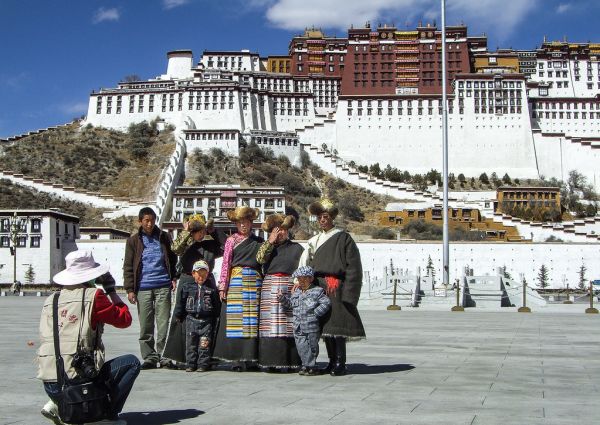 Tibetan nomad family in front of Potala Palace