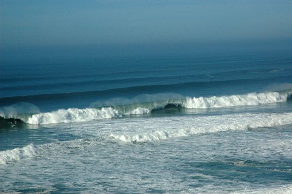 Offshore wind on waves, blue rolls in from a long distance away, Pomponio State Beach, Pescadero, California, USA