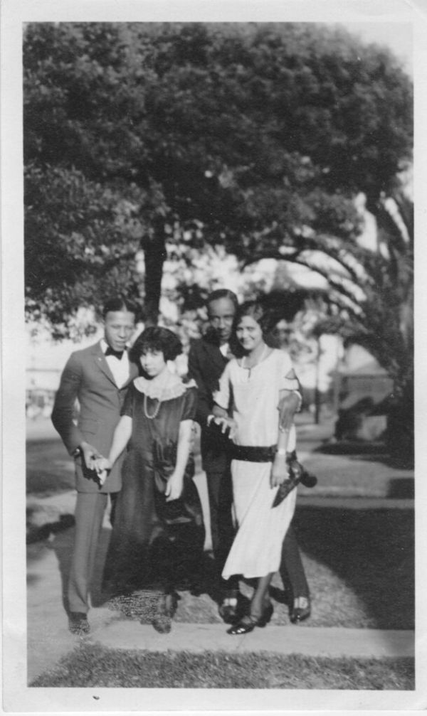 'Away from studies' photograph of University of Southern California students Edwin Jefferson, Mattie Pearl Hawkins, Warner Wright, and Willia B. Nickerson. (exbt-BHE-011)